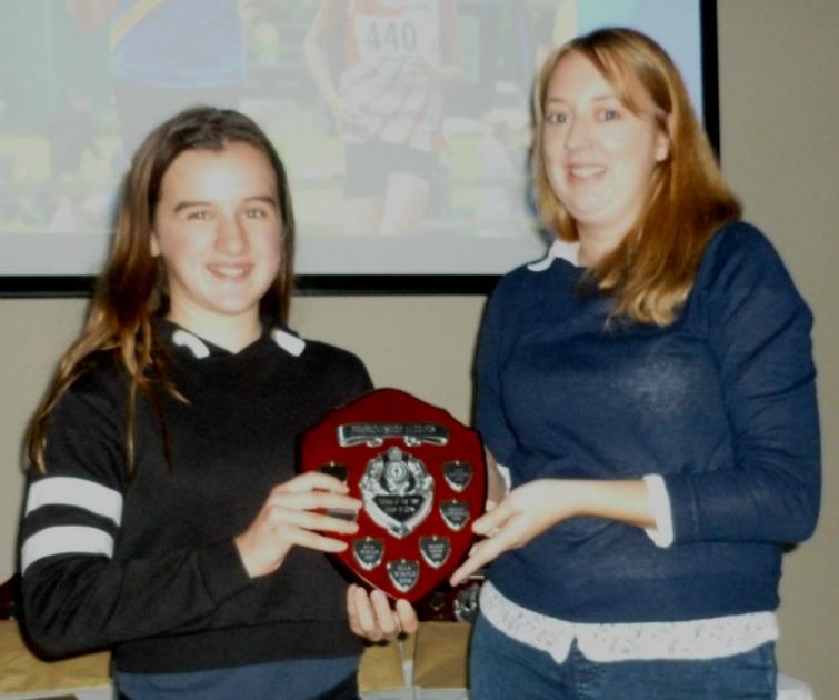 Ella Wintle receiving her trophy at the Pembrokeshire Harriers presentation evening
